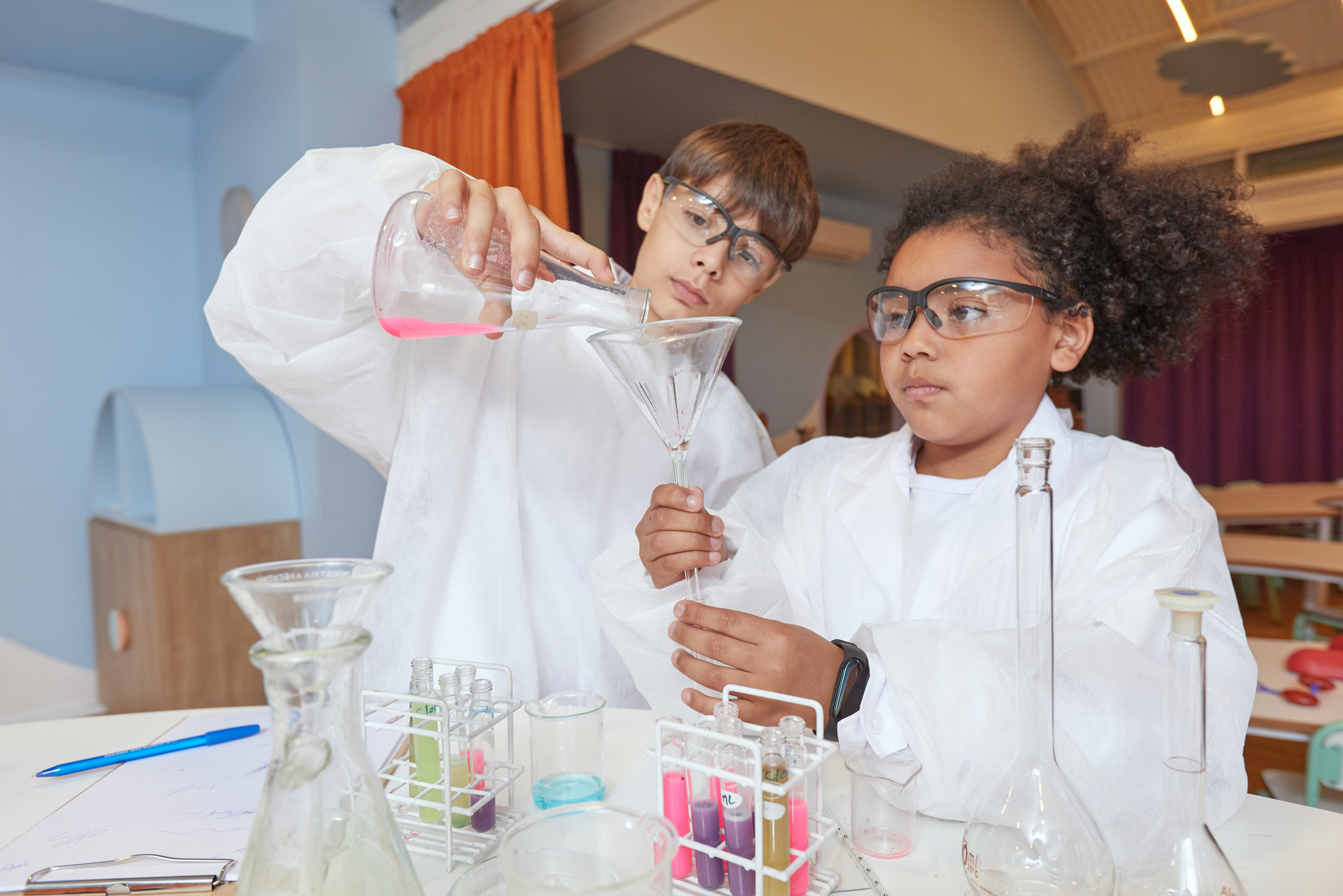 Two Children Doing Science Experiment Together